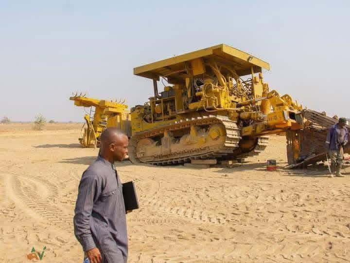 Heavy machinery clearing farmland