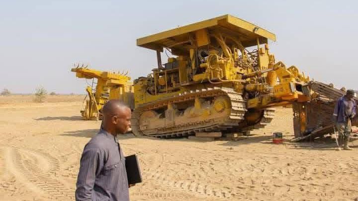 Heavy machinery clearing farmland